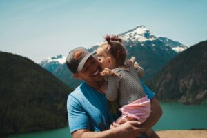 A father joyfully holding his daughter